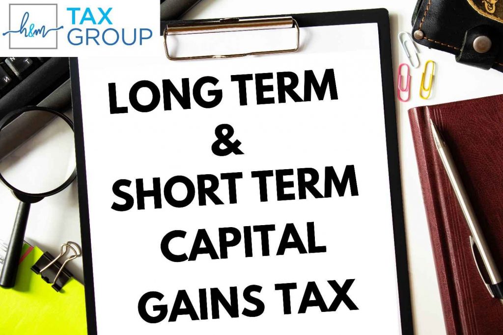 Professional tax consultant analyzing 2026 short-term and long-term capital gains tax rates for an investor.